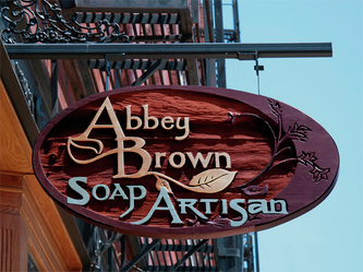 Image of the Wooden Sign Company's Wood Blade Sign for Abbey Brown Soap Artisan in Chicago's Old Town Neighborhood