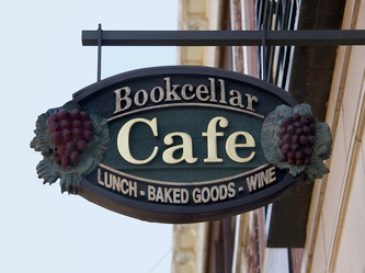 Image of the Wooden Sign Company's Bookcellar Cafe Hanging blade sign in Chicago,IL