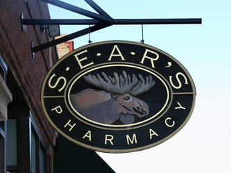 Image of the Wooden Sign Company's Sears Pharmacy Sign in Oak Park, IL, Wooden Signs Wisconsin